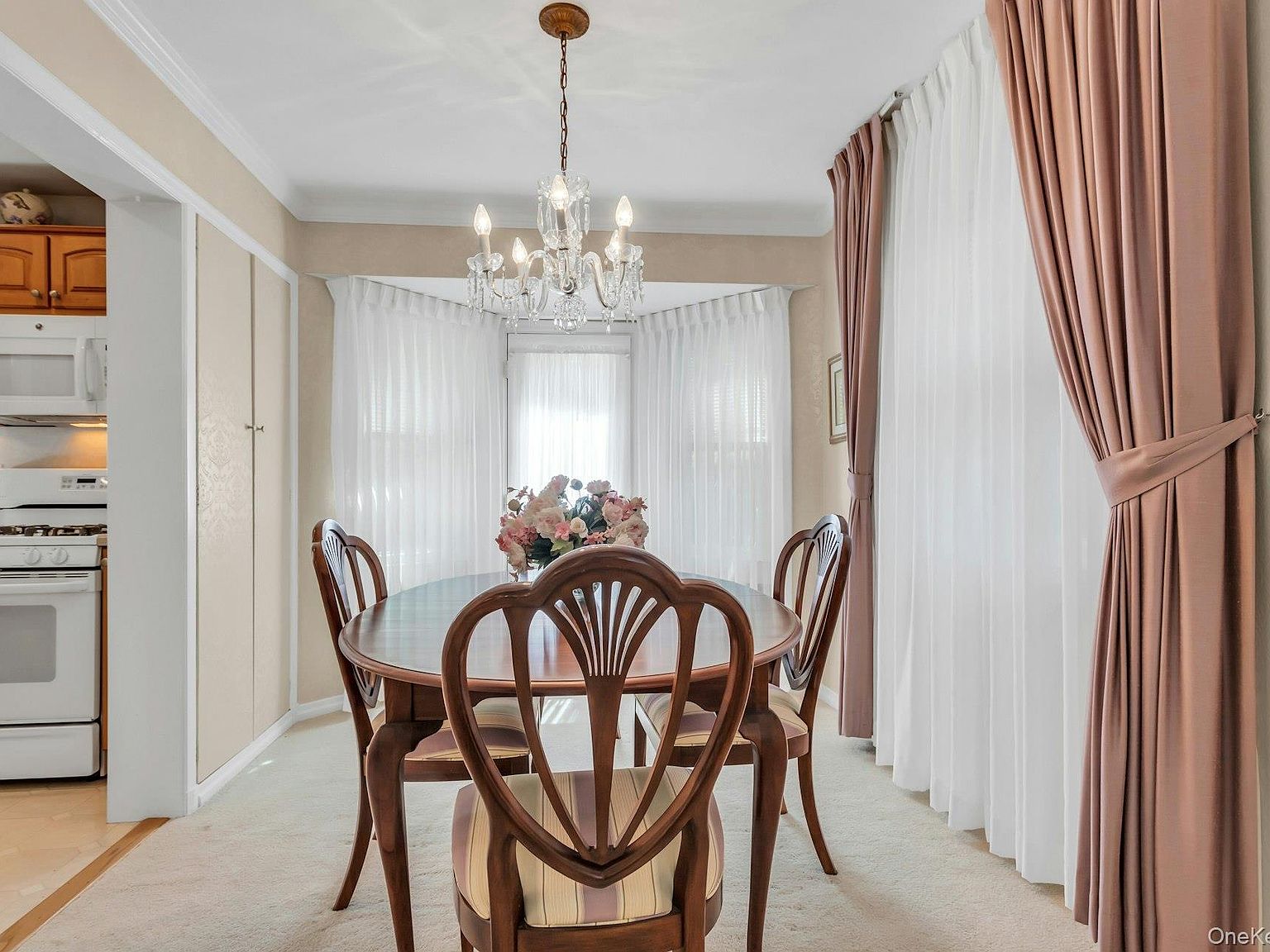 Dining room with custom built-in closets and natural light