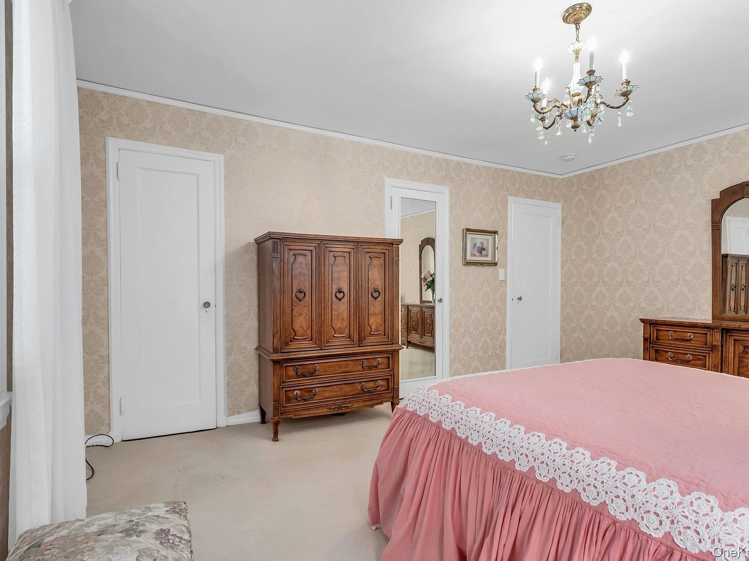 First-floor bedroom with oak floors and built-in closet